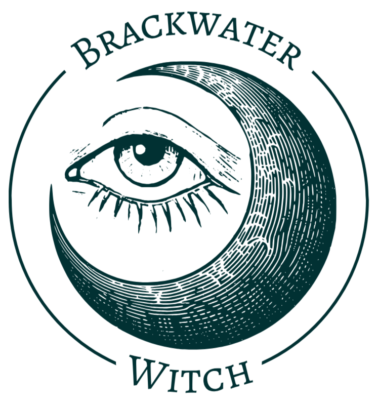 BWW Logo A waxing crescent moon cradling an eye surrounded by the text "Brackwater Witch"